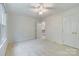 Spacious bedroom featuring neutral carpet and ceiling fan at 10927 Thornhill Club Dr, Charlotte, NC 28277