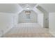 Bright bonus room with neutral carpet, natural light and vaulted ceiling at 10927 Thornhill Club Dr, Charlotte, NC 28277