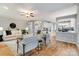 Open-concept living space with hardwood floors, comfortable seating, and seamless access to other rooms at 10927 Thornhill Club Dr, Charlotte, NC 28277