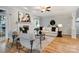 Comfortable living room features a fireplace, hardwood floors, natural light, and stylish furnishings at 10927 Thornhill Club Dr, Charlotte, NC 28277