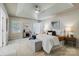 Main bedroom featuring tray ceiling, plantation shutters and sitting area at 10927 Thornhill Club Dr, Charlotte, NC 28277