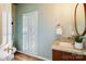Stylish powder room with granite vanity top, modern fixtures, and a decorative mirror at 10927 Thornhill Club Dr, Charlotte, NC 28277