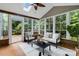 Sunroom with skylight and access to wooden deck at 10927 Thornhill Club Dr, Charlotte, NC 28277