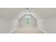 Finished attic space featuring carpeted floors, a window offering natural light, and ceiling fan, perfect for storage or flex space at 116 Eve Ash Ln, Mooresville, NC 28115