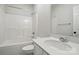 White full bathroom featuring a white tub, toilet, sink and tile floors at 116 Eve Ash Ln, Mooresville, NC 28115