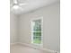Bedroom featuring neutral walls, carpeted floor, and a large window bringing in natural light at 116 Eve Ash Ln, Mooresville, NC 28115