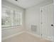 Small bedroom with a window bringing in natural light, carpet floors, and a closet door at 116 Eve Ash Ln, Mooresville, NC 28115