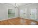 Bright dining room with large windows and hardwood floors offers a welcoming space at 116 Eve Ash Ln, Mooresville, NC 28115