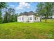 A modern farmhouse exterior features white siding, black trim, and an attached two-car garage at 116 Eve Ash Ln, Mooresville, NC 28115