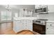 Well-equipped kitchen featuring stainless steel appliances and stylish white cabinetry at 116 Eve Ash Ln, Mooresville, NC 28115