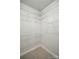 Walk-in closet featuring white wire rack shelves around a carpeted floor at 116 Eve Ash Ln, Mooresville, NC 28115