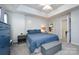 Bedroom features a tray ceiling, bright natural light, and ample space at 12328 Jessica Pl, Charlotte, NC 28269