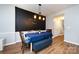 Cozy dining room with wood floors, modern lighting, and chalkboard wall at 12328 Jessica Pl, Charlotte, NC 28269