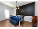 Dining room with wood floors, modern lighting, and fun chalkboard wall at 12328 Jessica Pl, Charlotte, NC 28269
