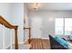 Inviting entryway featuring staircase with wood accents and a clear view of the interior living space and front door at 12328 Jessica Pl, Charlotte, NC 28269