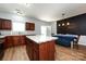 Bright kitchen featuring an island, dining area, and modern appliances at 12328 Jessica Pl, Charlotte, NC 28269