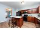 Modern kitchen with a center island, sleek appliances, and an open layout at 12328 Jessica Pl, Charlotte, NC 28269
