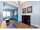 Bright living area showcasing wood floors, modern furnishings, and seamless flow to other spaces at 12328 Jessica Pl, Charlotte, NC 28269