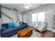 Bright and inviting living area with a comfortable sofa, armchair, and natural light creating a cozy ambiance at 12328 Jessica Pl, Charlotte, NC 28269