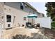 Outdoor patio with umbrella, seating, and charming backyard at 12328 Jessica Pl, Charlotte, NC 28269