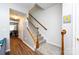 Interior view showcasing a staircase with wood and carpeted steps, blending functionality with classic design at 12328 Jessica Pl, Charlotte, NC 28269