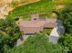 Aerial view of a private home surrounded by mature trees and lush greenery at 12705 Caldwell Rd, Charlotte, NC 28213