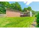 Beautifully maintained backyard with expansive lawn and mature trees at 12705 Caldwell Rd, Charlotte, NC 28213