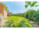 The backyard features lush greenery, a well-manicured lawn, and privacy landscaping at 12705 Caldwell Rd, Charlotte, NC 28213