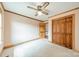 Bright bedroom with carpet, ceiling fan, and closet at 12705 Caldwell Rd, Charlotte, NC 28213