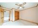 Cozy bedroom with ceiling fan, wood trim, and closet at 12705 Caldwell Rd, Charlotte, NC 28213