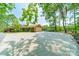 Attached brick garage with a basketball hoop and a large driveway for ample parking at 12705 Caldwell Rd, Charlotte, NC 28213