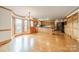 Open kitchen with wood cabinets, breakfast bar, and view to the backyard at 12705 Caldwell Rd, Charlotte, NC 28213