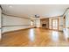 Living room boasts hardwood floors, brick fireplace, and ample natural light at 12705 Caldwell Rd, Charlotte, NC 28213