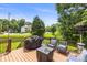 Inviting back deck with an outdoor seating area perfect for relaxing and enjoying the view at 128 Sugar Thyme Ln, Mooresville, NC 28115