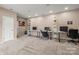 Spacious carpeted basement with multiple desk areas, suitable for office or recreation at 128 Sugar Thyme Ln, Mooresville, NC 28115