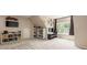 Finished basement featuring a mounted TV, shelving, and a window with natural light at 128 Sugar Thyme Ln, Mooresville, NC 28115