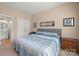 Neutral-toned bedroom with a double bed and ensuite bathroom at 128 Sugar Thyme Ln, Mooresville, NC 28115