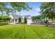 Community clubhouse with well manicured grounds, playground and pool at 128 Sugar Thyme Ln, Mooresville, NC 28115