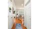 Inviting hallway leads to the breakfast nook with beautiful hardwood floors and natural light at 128 Sugar Thyme Ln, Mooresville, NC 28115