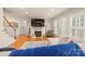 Bright living room featuring a fireplace, hardwood floors, and natural light with plenty of windows at 128 Sugar Thyme Ln, Mooresville, NC 28115