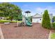 Community playground with slide and climbing equipment for to enjoy at 128 Sugar Thyme Ln, Mooresville, NC 28115
