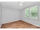 Bedroom featuring wood floors, neutral walls, and a large window for natural light at 1310 Glasscock Rd, Rock Hill, SC 29730