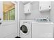 Bright laundry area features a modern white washer and dryer and access to outside at 1310 Glasscock Rd, Rock Hill, SC 29730
