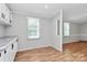 Open-concept living space with views to another room, hardwood flooring, natural light; modern and comfortable at 1310 Glasscock Rd, Rock Hill, SC 29730