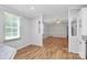 Bright living space with wood floors, open to other areas, natural light pouring in from large windows, a welcoming atmosphere at 1310 Glasscock Rd, Rock Hill, SC 29730