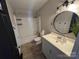 Bathroom featuring a tub/shower combo, vanity with sink, and neutral color scheme at 13211 Asbury Chapel Rd, Huntersville, NC 28078