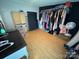 Bedroom showcasing a large closet, hardwood floors, and ample storage space at 13211 Asbury Chapel Rd, Huntersville, NC 28078