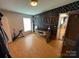 Bedroom featuring hardwood floors, a desk, and natural light at 13211 Asbury Chapel Rd, Huntersville, NC 28078