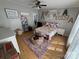 Bedroom featuring a twin bed, hardwood floors, ceiling fan, and ample natural light at 13211 Asbury Chapel Rd, Huntersville, NC 28078