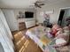 Bedroom featuring a twin bed, hardwood floors, ceiling fan, and a dresser with TV at 13211 Asbury Chapel Rd, Huntersville, NC 28078